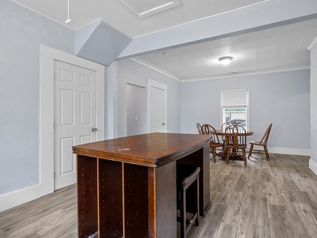 24 Oak St, Spartanburg, SC 29306 - kitchen featuring ornamental molding and wood finished floors