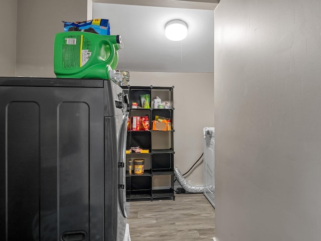 24 Oak St, Spartanburg, SC 29306 - laundry room with wood finished floors and washer and dryer