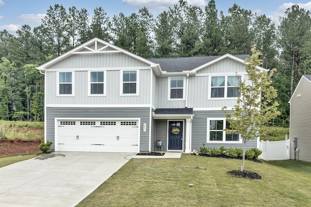 2097 Evanston Dr, Wellford, SC 29385 - view of front of property with driveway, a garage, and board and batten siding
