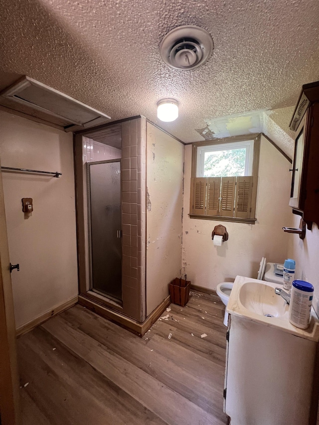 109 Berry Rd, Boiling Springs, SC 29316 - full bathroom featuring vanity, a shower stall, wood finished floors, and a textured ceiling