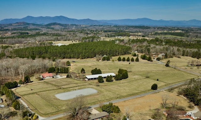 226 John Smith Rd, Columbus, NC 28722 - aerial view of property and surrounding area featuring rural landscape and a mountainous background