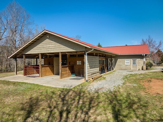 226 John Smith Rd, Columbus, NC 28722 - view of front of property featuring an exterior structure, a metal roof, and an outdoor structure