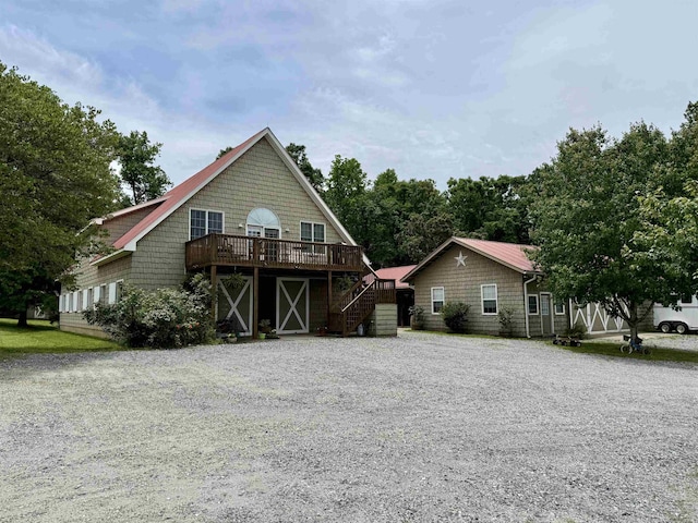 226 John Smith Rd, Columbus, NC 28722 - view of front of home with a wooden deck, stairway, and gravel driveway