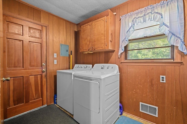 195 Seigle Dr, Inman, SC 29349 - laundry area with independent washer and dryer, cabinet space, electric panel, wood walls, and a textured ceiling
