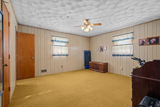 195 Seigle Dr, Inman, SC 29349 - bedroom with carpet floors, a textured ceiling, wooden walls, and ceiling fan