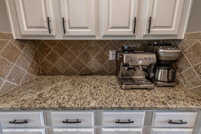 112 Murdock Ln, Greer, SC 29651 - kitchen featuring white cabinets, decorative backsplash, and light stone countertops