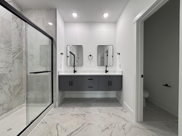 953 Mike Cir, Boiling Springs, SC 29303 - full bathroom with marble finish flooring, a shower stall, double vanity, and recessed lighting