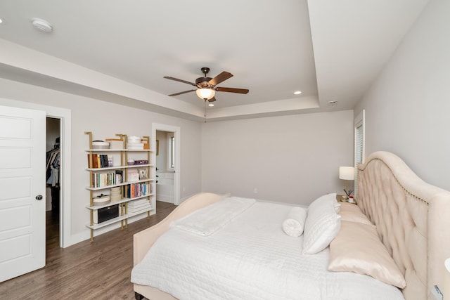 881 Cothran Rd, Inman, SC 29349 - bedroom with wood finished floors, a raised ceiling, recessed lighting, a spacious closet, and ensuite bathroom