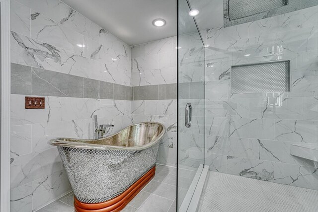 825 N Franklin Rd, Greenville, SC 29617 - bathroom featuring a freestanding tub, a marble finish shower, tile walls, and recessed lighting