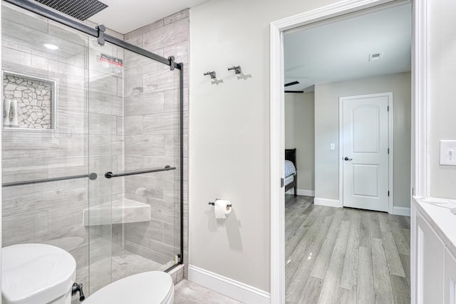 825 N Franklin Rd, Greenville, SC 29617 - full bathroom with a stall shower, vanity, wood finished floors, and ensuite bath