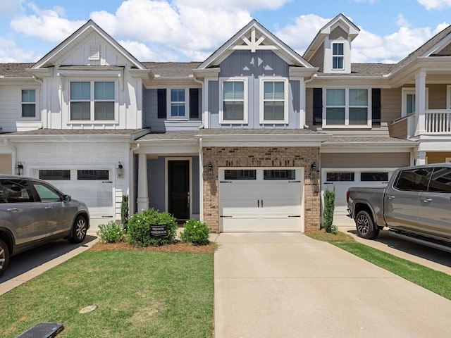 115 Turfway Dr, Greer, SC 29651 - view of property with board and batten siding, a garage, driveway, a front yard, and brick siding