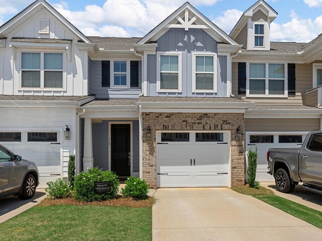 115 Turfway Dr, Greer, SC 29651 - multi unit property with board and batten siding, a garage, concrete driveway, and a shingled roof