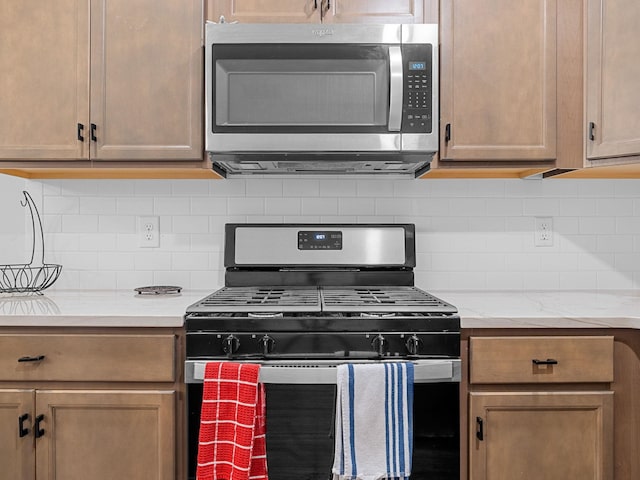 115 Turfway Dr, Greer, SC 29651 - kitchen with appliances with stainless steel finishes and tasteful backsplash