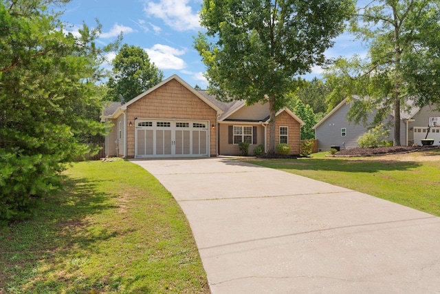 719 S Bomar Ave, Landrum, SC 29356 - view of front facade with an attached garage, a front lawn, and driveway