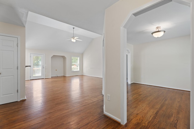 719 S Bomar Ave, Landrum, SC 29356 - unfurnished room featuring arched walkways, dark wood finished floors, a ceiling fan, and vaulted ceiling