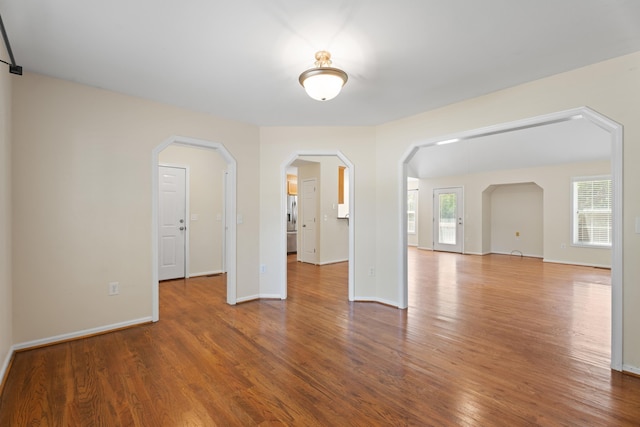 719 S Bomar Ave, Landrum, SC 29356 - spare room with wood finished floors and arched walkways