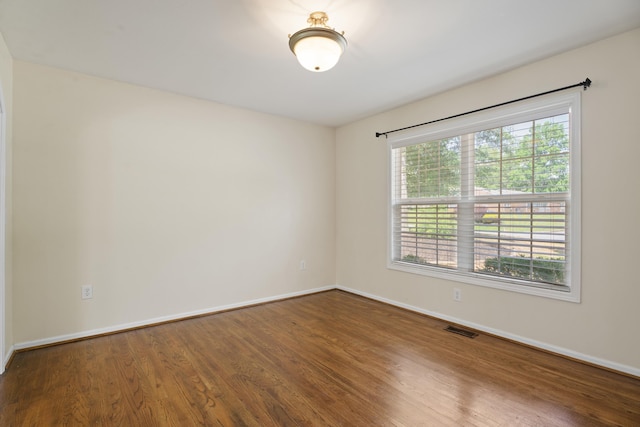 719 S Bomar Ave, Landrum, SC 29356 - spare room with wood finished floors and baseboards