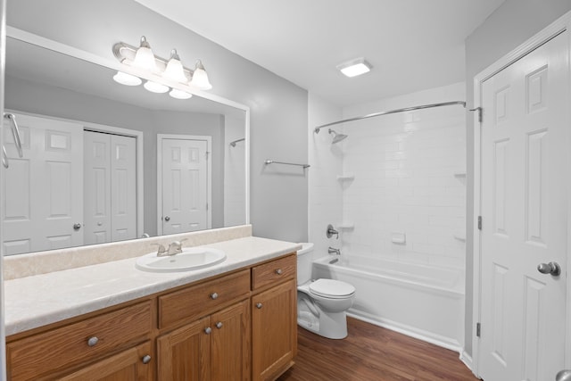 719 S Bomar Ave, Landrum, SC 29356 - full bathroom featuring vanity, wood finished floors, a closet, and  shower combination