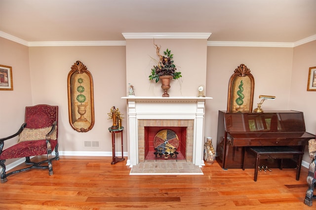 147 Hillbrook Dr, Spartanburg, SC 29307 - living area featuring a fireplace, wood finished floors, and crown molding