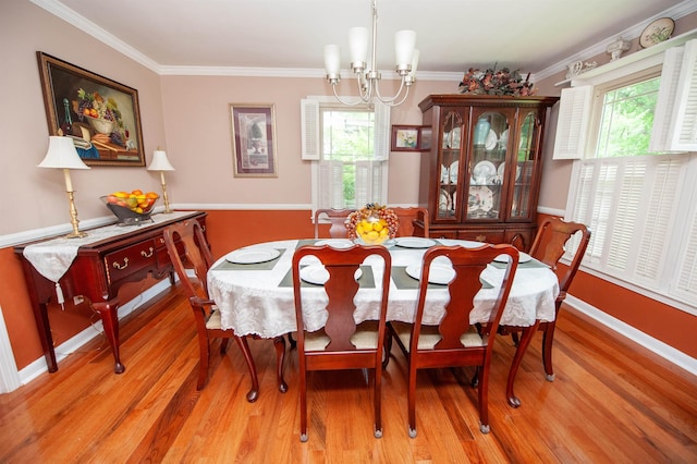 147 Hillbrook Dr, Spartanburg, SC 29307 - dining space featuring a chandelier, crown molding, plenty of natural light, and light wood-style floors