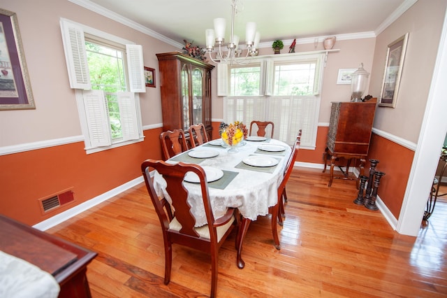 147 Hillbrook Dr, Spartanburg, SC 29307 - dining room featuring a chandelier, plenty of natural light, light wood-type flooring, and crown molding