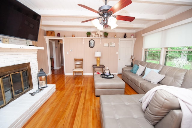 147 Hillbrook Dr, Spartanburg, SC 29307 - living room featuring beamed ceiling, ceiling fan, light wood finished floors, and a fireplace
