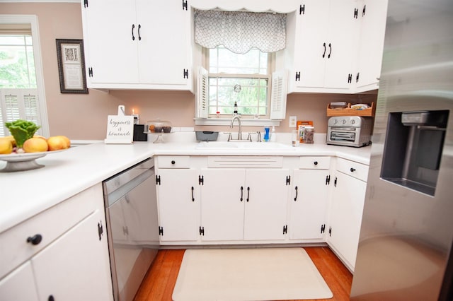 147 Hillbrook Dr, Spartanburg, SC 29307 - kitchen with stainless steel appliances, light countertops, plenty of natural light, and white cabinets