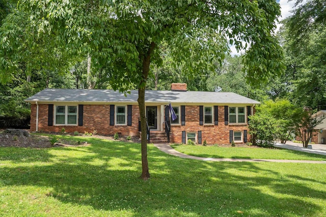 147 Hillbrook Dr, Spartanburg, SC 29307 - single story home featuring brick siding, a front lawn, and a chimney