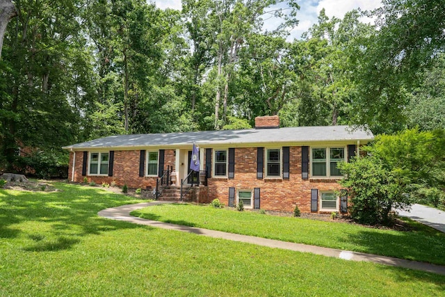 147 Hillbrook Dr, Spartanburg, SC 29307 - ranch-style house featuring a front yard, a chimney, and brick siding
