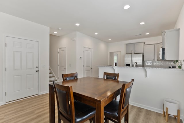 3008 Olivette Pl, Duncan, SC 29334 - dining room with light wood-style flooring, stairs, and recessed lighting