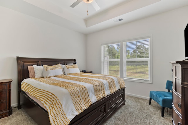 3008 Olivette Pl, Duncan, SC 29334 - bedroom with light colored carpet, a raised ceiling, and ceiling fan