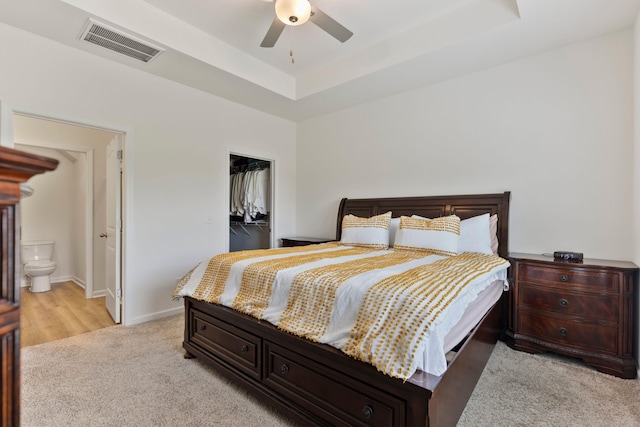 3008 Olivette Pl, Duncan, SC 29334 - bedroom with a raised ceiling, light colored carpet, a closet, a spacious closet, and ensuite bathroom