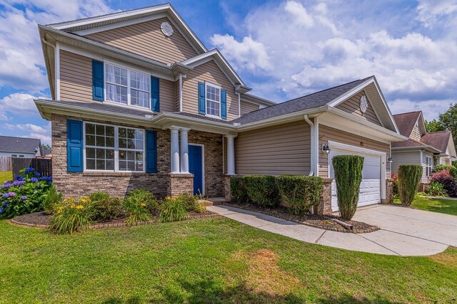 811 S Edisto River Dr, Roebuck, SC 29376 - view of front of home with a garage, concrete driveway, a front yard, and brick siding