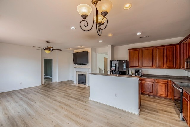 811 S Edisto River Dr, Roebuck, SC 29376 - kitchen with stainless steel appliances, dark countertops, recessed lighting, light wood-type flooring, and open floor plan