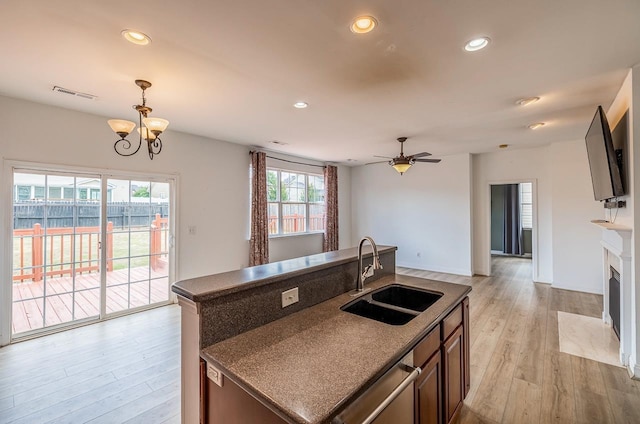 811 S Edisto River Dr, Roebuck, SC 29376 - kitchen with dark countertops, light wood-type flooring, recessed lighting, open floor plan, and pendant lighting