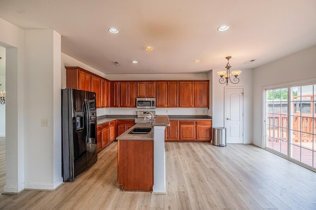 811 S Edisto River Dr, Roebuck, SC 29376 - kitchen featuring stainless steel microwave, black fridge with ice dispenser, a chandelier, light wood-type flooring, and brown cabinetry