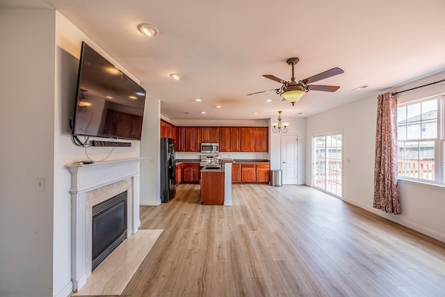811 S Edisto River Dr, Roebuck, SC 29376 - kitchen featuring stainless steel appliances, a ceiling fan, light wood-style floors, recessed lighting, and brown cabinetry