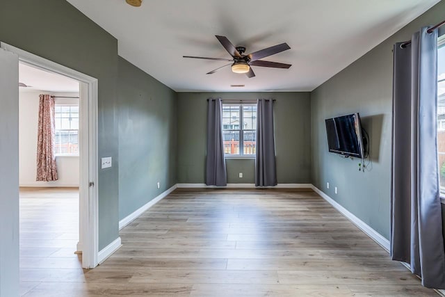 811 S Edisto River Dr, Roebuck, SC 29376 - spare room with a ceiling fan, light wood finished floors, and a smoke detector