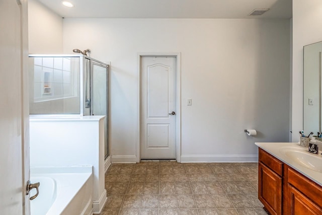 811 S Edisto River Dr, Roebuck, SC 29376 - bathroom featuring vanity, a shower stall, and a garden tub