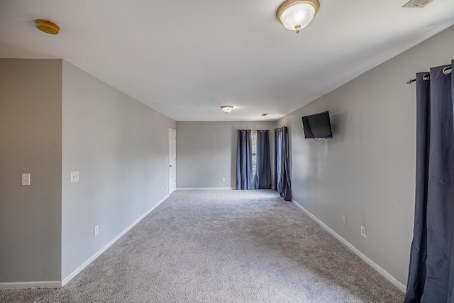 811 S Edisto River Dr, Roebuck, SC 29376 - spare room featuring carpet and a smoke detector