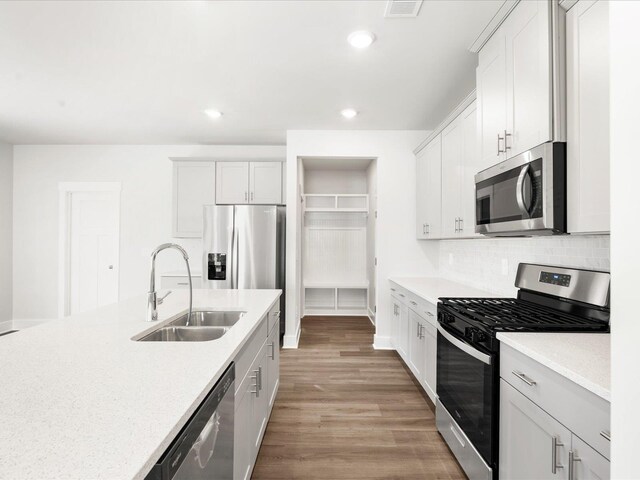 791 Burghley Cir, Greer, SC 29651 - kitchen with appliances with stainless steel finishes, recessed lighting, light wood-style floors, light countertops, and decorative backsplash