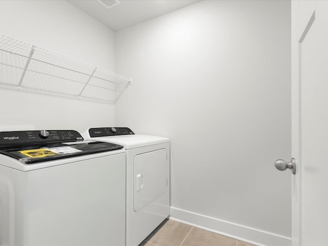 791 Burghley Cir, Greer, SC 29651 - laundry room with washer and clothes dryer and light tile patterned floors