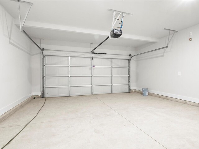 791 Burghley Cir, Greer, SC 29651 - garage featuring a garage door opener and baseboards