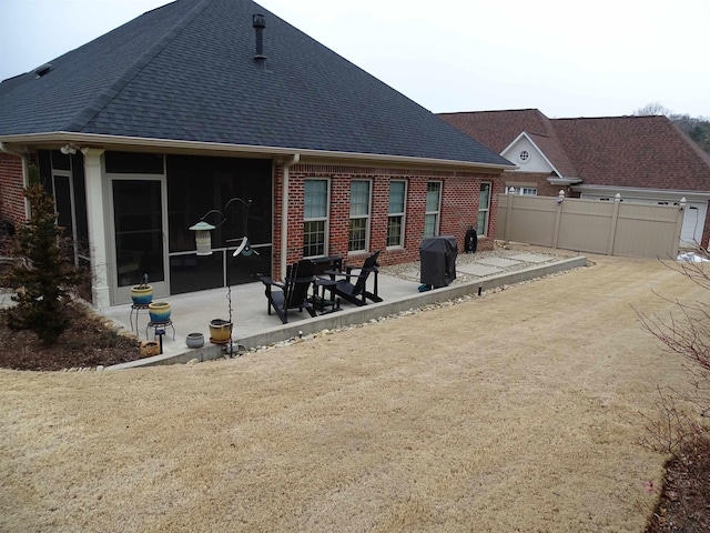 811 White Magnolia Dr, Inman, SC 29349 - back of property featuring brick siding, a patio, and a shingled roof