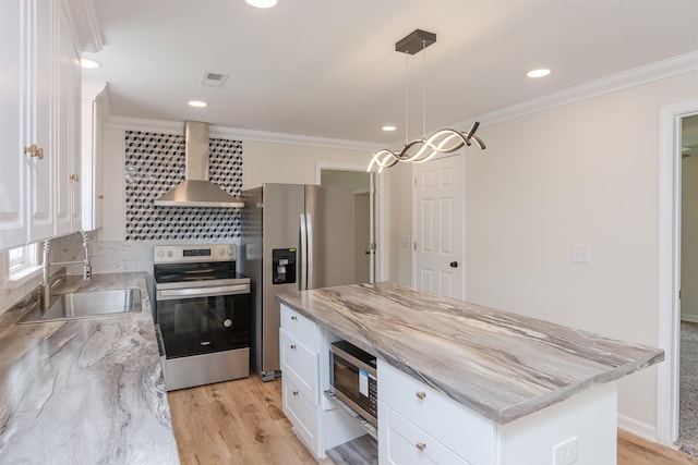 1230 Edgewood Ave, Spartanburg, SC 29301 - kitchen featuring wall chimney exhaust hood, appliances with stainless steel finishes, crown molding, white cabinetry, and light wood-style floors