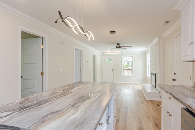 1230 Edgewood Ave, Spartanburg, SC 29301 - kitchen with white cabinetry, crown molding, light wood finished floors, light stone counters, and ceiling fan