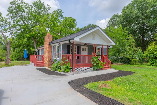 1230 Edgewood Ave, Spartanburg, SC 29301 - view of front of home with covered porch, a front lawn, ceiling fan, a chimney, and concrete driveway