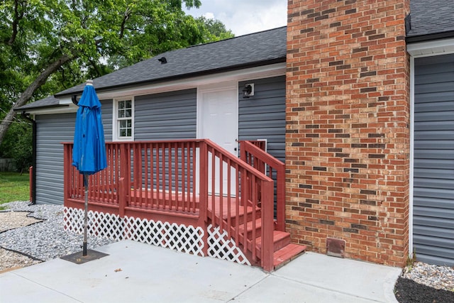 1230 Edgewood Ave, Spartanburg, SC 29301 - entrance to property featuring a shingled roof, a deck, and a chimney
