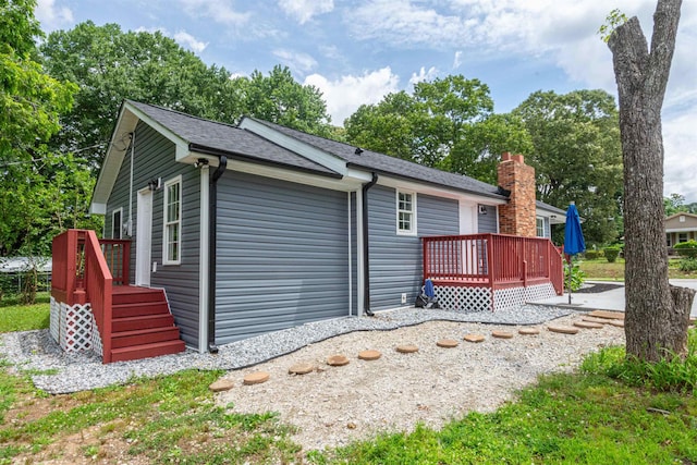 1230 Edgewood Ave, Spartanburg, SC 29301 - rear view of property with a wooden deck, a shingled roof, a garage, and a chimney