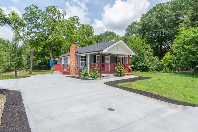 1230 Edgewood Ave, Spartanburg, SC 29301 - ranch-style home featuring covered porch, a front yard, concrete driveway, a chimney, and a ceiling fan